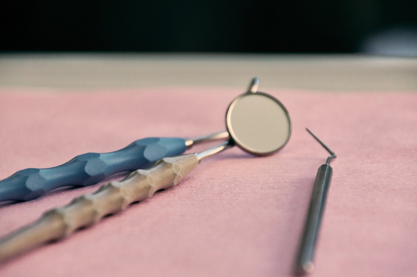 Endodontist treating a patient with advanced dental equipment in New York City